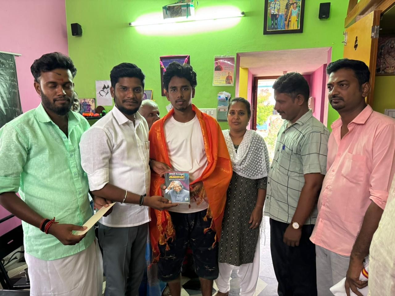 Congratulated 12th-standard first-rank student in person