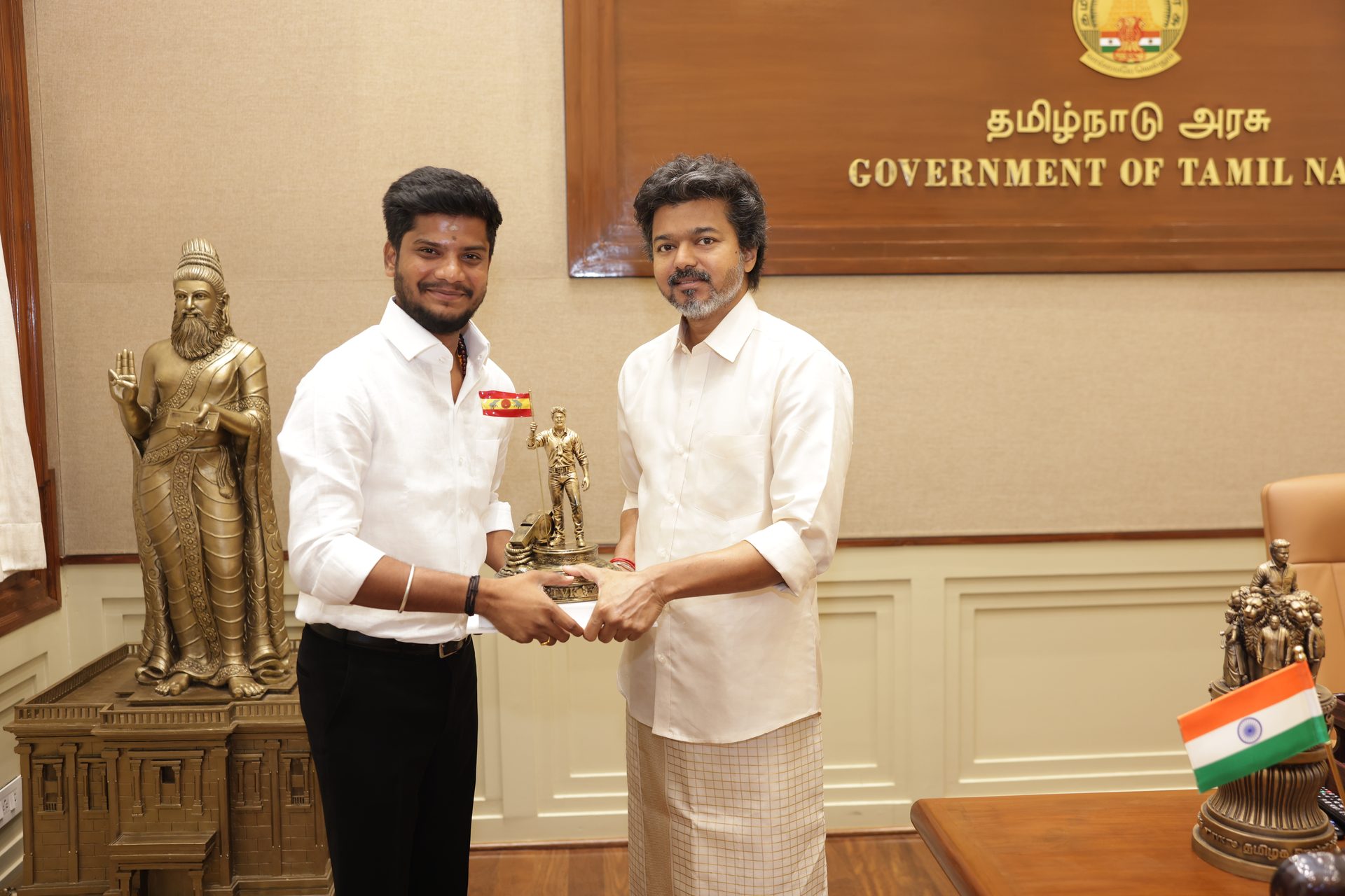 Presenting a memento at the Chief Minister's Office