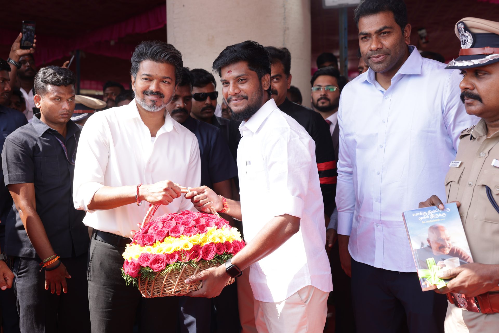 Welcoming CM Vijay with a flower basket