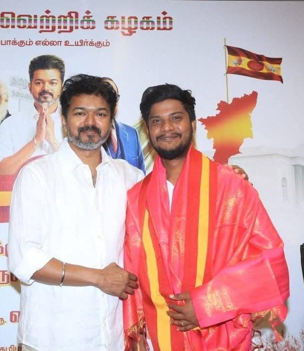 With CM Vijay after receiving the TVK shawl