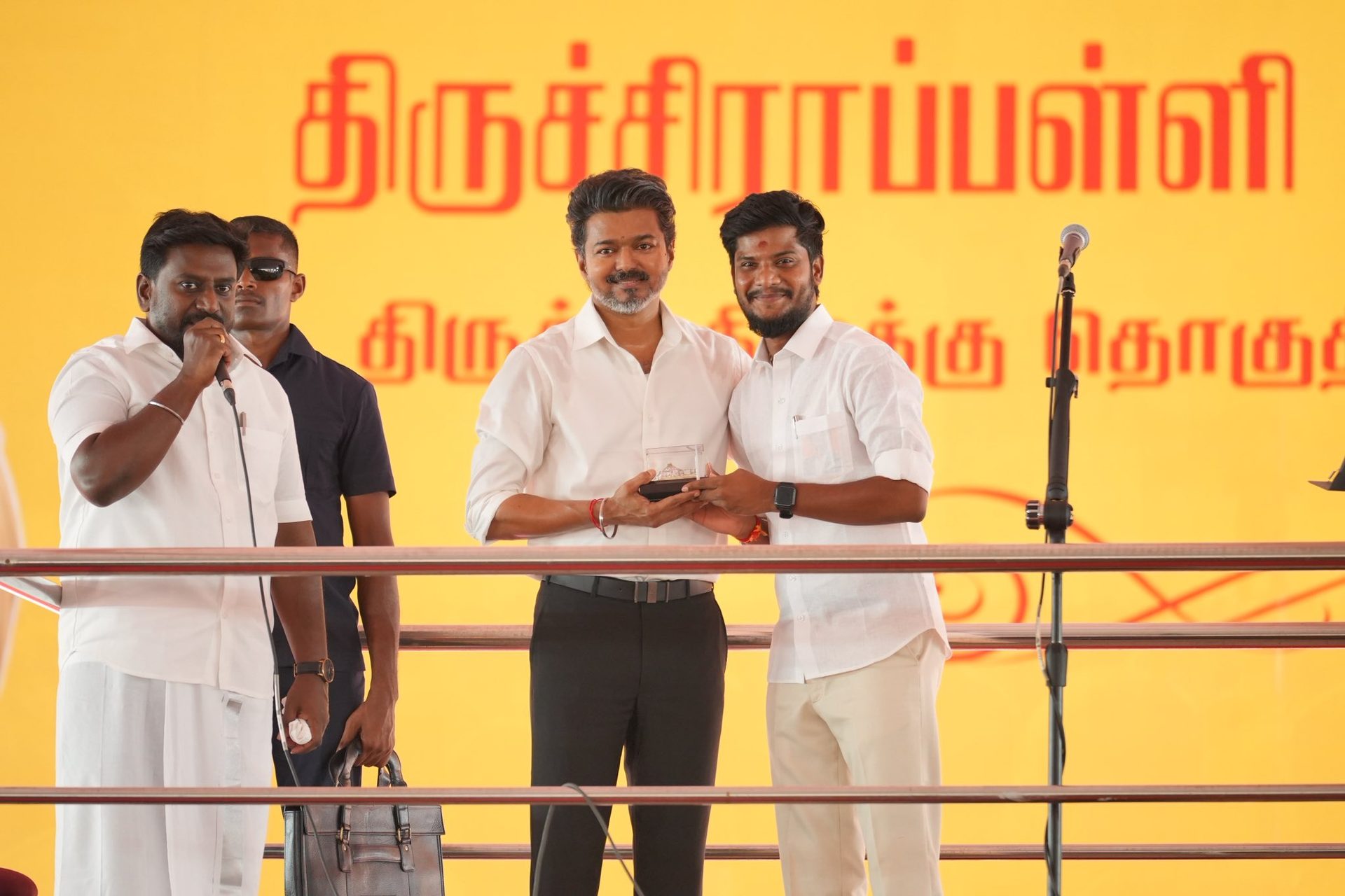Receiving a memento from CM Vijay at the Trichy District Meeting